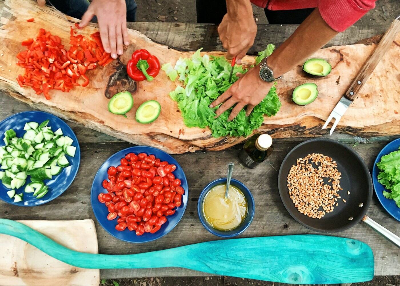 Hands chopping fresh vegetables
